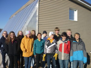 The New London-Spicer YES! team with the new passive solar greenhouse