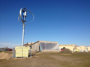 The New London-Spicer school greenhouse and vertical-axis wind turbine