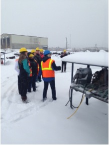 Susan Darley-Hill of WLSSD shows the YES! team how they are able to work with compost even in wintry conditions