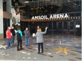 Chelly Townsend shows the Duluth YES! team the entrance to the LEED certified Amsoil Arena. 