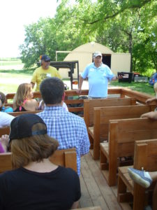 Attendees aboard the "people mover" to view the Ney homestead